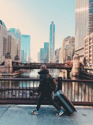 tourist dragging bags through city
